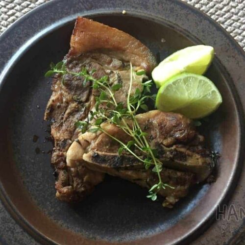 Juicy Tender Pork chops seared and baked in oven with Lemons and Thyme