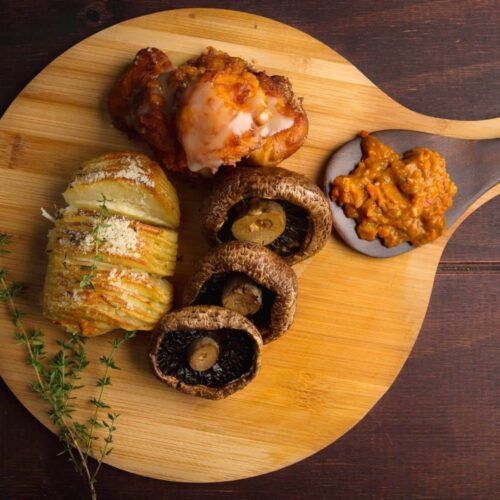 Grilled Portabello Mushroom, Hasselback Potato, Pumpkin Fritters & Chakalaka