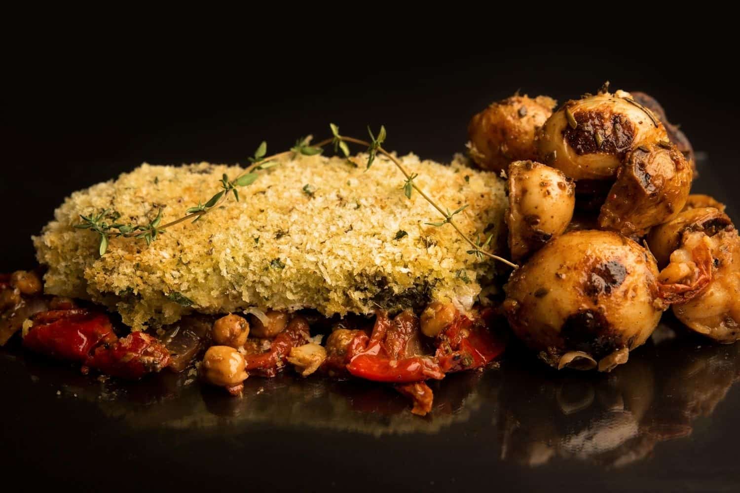 Pesto Crusted Hake with Roast Potato, Red Onion & Chickpea Bake